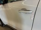 a white car that has a sticker on the side of it