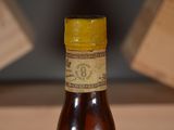 a bottle of beer that is sitting on a table