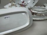 a white plate with a flowered design on it