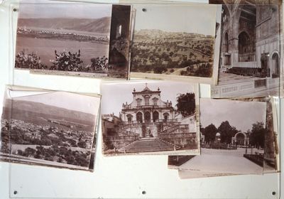 many old photos hanging on the wall of a building