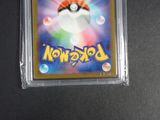 a close up of a pokemon card on a table