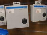three boxes that are hanging on a rack in a store