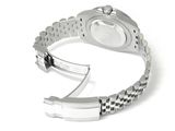 a watch that is sitting on top of a silver bracelet