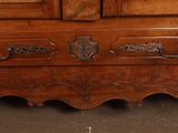 a wooden dresser with a mirror on top of it