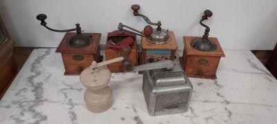 many different types of coffee grinders on a table