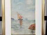 framed watercolor painting of a sailboat in a calm sea