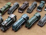 a lot of toy trains that are on the ground