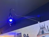 a blue light that is on the wall of a restaurant
