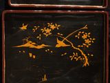 two trays with birds and flowers painted on them