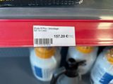 a label on a bottle of milk on a shelf