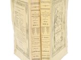 deux vieux livres ouverts sur une surface blanche