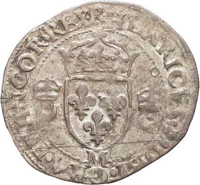 a close up of a coin with a coat of arms on it