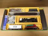 a box with a train set in it on a table