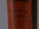 a close up of a wooden stick with a label on it