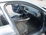 a car door open with the driver ' s seat down