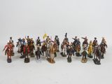 a lot of figurines that are on a white surface