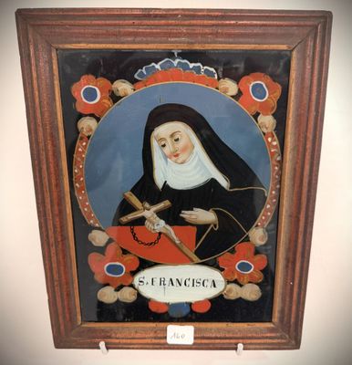 an image of a painting of a nun holding a cross in a frame