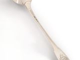 silver spoon on a white surface on a white surface