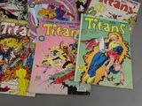 a lot of comic books that are on the table