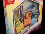 a box of pokemon cards on display on a black background