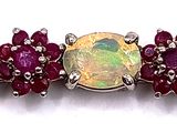 an oplite, ruby and white topazte bracelet