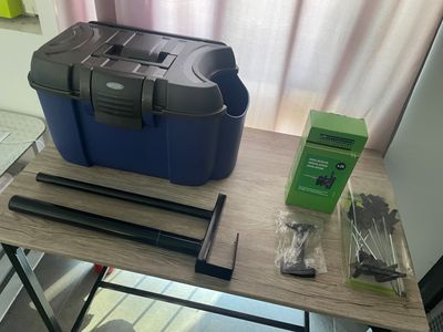 a table with a tool box and other items on it