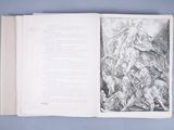 an open book with a drawing of a man on a horse