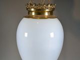 an image of a white lamp hanging from a gold chain