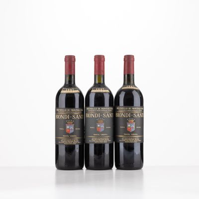 three bottles of wine sitting on top of a white table