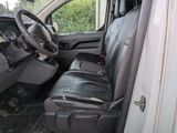 a picture of the inside of a van with the driver ' s seat up