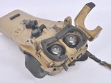 an image of a pair of binoculars sitting on top of a white surface