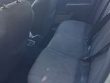 two seats in the back of a small car