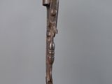 an image of a bronze sculpture of a person on a stand