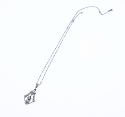 sterling silver necklace with a diamond pendant on a chain on a white background