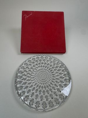 a glass plate with a red box on the table