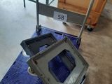 a dolly cart with a tv on it in a room