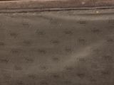 a brown bag with a pattern on it sitting on a table