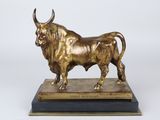 bronze statue of a bull on a marble base