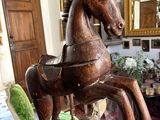 a statue of a horse that is on display in a room