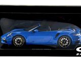 the blue car is in a black box on a white background