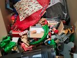 a cardboard box filled with toys and other items