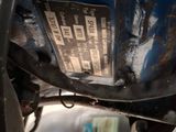 a close up view of a car ' s engine and exhaust pipe