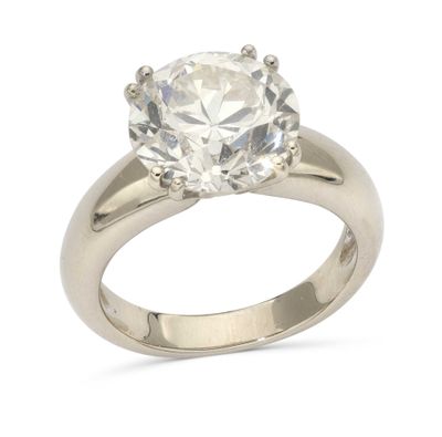 a close up of a diamond ring on a white background