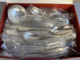 a lot of silver spoons and spoons in a box