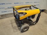 an image of a small yellow machine sitting on top of a cement floor