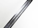 a close up of a sword on a white surface