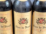 three bottles of wine sitting on top of a table next to each other
