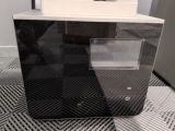 a black and white picture of a microwave on the floor