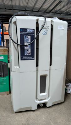 an image of a white refrigerator in a warehouse