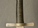a sword that is sitting on top of a table